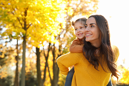 500x332_0009_Happy woman with little daughter in sunny park. Autumn walk Image Text: 500x332_0009_Happy woman with little daughter in sunny park. Autumn walk